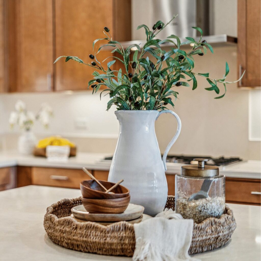 Kitchen island with decorative plant arrangement.