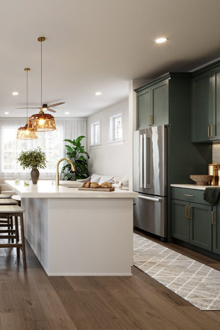 Modern kitchen with green cabinets and island.