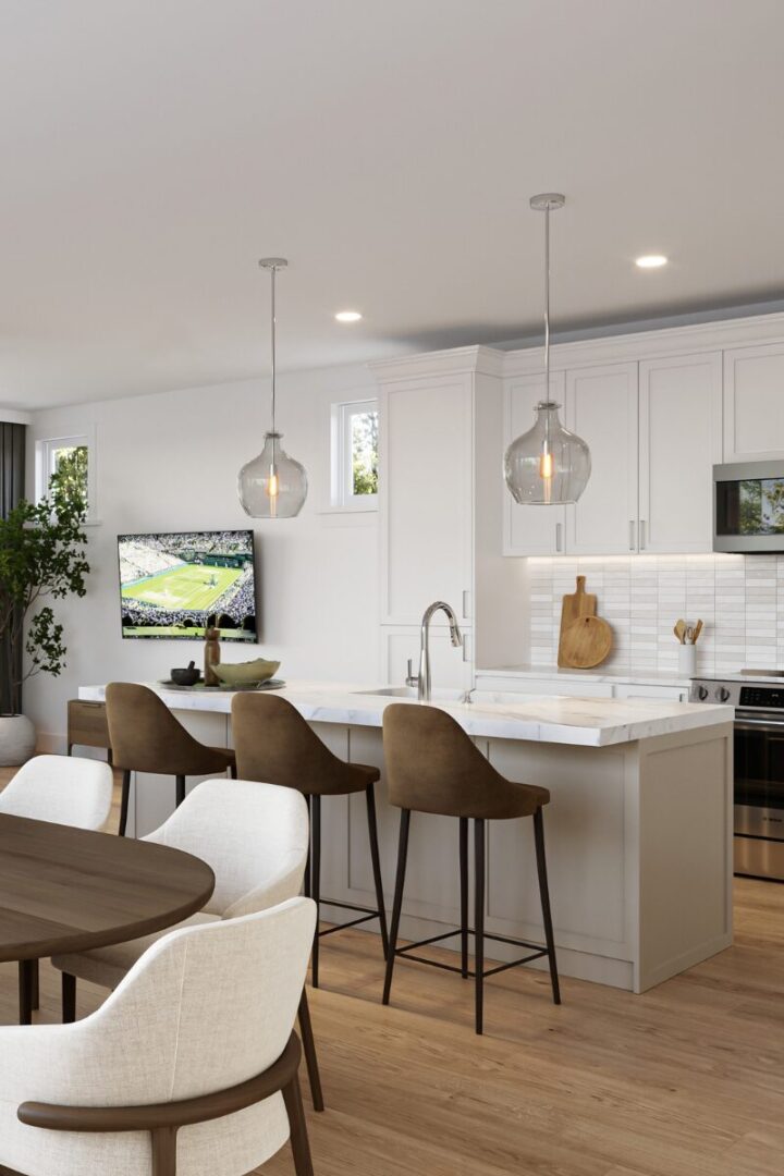 Modern kitchen and dining area with island.