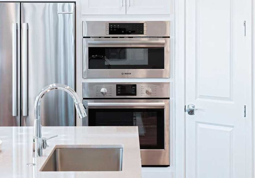 Modern kitchen with stainless steel appliances.